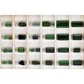 Unmounted green gem tourmalines twentynine most in faceted emerald cuts three pear or triangular faceted and six oval cabochons 149 cts 235 cts tw largest 39 cts note unmounted gemstones fr