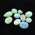 Ten unmounted gem opals oval and pear shapes 44 cts tw note unmounted gemstones from the estate of harry b roth 19132008 a longtime member of the diamond dealer club of ny a connoisseur and