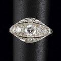 Art deco diamond platinum ring pierced lateral design with chased details seven transitional cut diamonds approx 120 cts tw 39 gs size 5 12