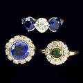 Three diamond and gemstone rings platinum three stone ring oec diamonds approx 95 ct two sapphires approx 180 cts tw accent diamonds two circular cluster gold rings green garnet with 50 ct