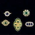 Five gemset diamond rings four in 14k with sapphires or emeralds ca 1900 one ca 1980 in 18k with emeralds in navette setting 25 cts tw diamonds 204 gs sizes 5 146 12