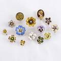 Fourteen art nouveau gold stickpins twelve flowers and two enameled portraits most enameled nine with diamonds 253 gs