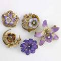 Five art nouveau enameled gold flower brooches each set with diamonds or pearls 14k yg unmarked 299 gs largest 1 58