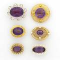 Six gold amethyst brooches ca 1900 carter  gough oval seed pearl border sloan oval seed pearl helix border oval platinum scroll with oec diamonds and seed pearls oval pearl laurel wreath circul