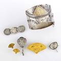 Japanesque gold and silver jewelry seven pieces 18801900 broad cuff with inlaid gold chester 1882 14k fan motif brooch with glazed obverse and matching earrings two silver fan brooches silver