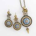 Archaeological revival enameled gold suite 18k bloomed gold pendant necklace and earrings ca 1870 principal disk element with starshaped pearl cluster on a turquoise enameled bosse white enamel b