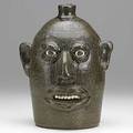 Lanier meaders glazed stoneware face jug with clay teeth and eyes signed 10 14 x 7 34
