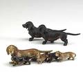 Vienna bronze dachshunds two figures one with four puppies the other a double figure early 20th c larger 5 34 x 1 34