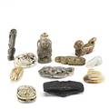 Eleven jade pieces includes sword guard animals figures and others in various colors 19th20th c tallest 2 38