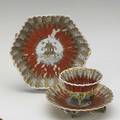 Chinese export tea bowl saucer and dish all with orange lappet patterns the tea bowl shaped like a lotus flower with lotus buds and stem feet ca 1760 largest 5