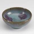 Jun ware bubble bowl covered overall in a thick pale blue glaze with a single lavender splash to the interior the foot unglazed for firing 1 78 x 3 34 dia