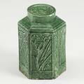 Green glazed hexagonal tea caddy each tapering side with arboreal decoration 18th19th c with fitted round cover 4 12
