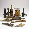 Wine accessories twelve pieces 19th20th c seven barrel spigots italian miniature grape press and three corkers tallest 10
