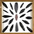Arrowheads and implements twentyone mounted and framed cascade leaf haskett gatecliff types and others in obsidian gray mottled flint and red mottled chert largest 6 14 frame 19 12 x 2
