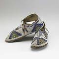 Moccasins pair of plains indians beaded moccasins with blue white green yellow and red beading 19th20th c 3 34 x 10 12 x 4