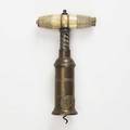 Thompson type corkscrew boneivory handle with brush plaque marked with dowler brand on bronze barrel 19th c 7