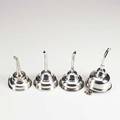 Wine funnels four 19th20th c one sterling possibly marked ic and lion passant and three in silver plate longest 5 34