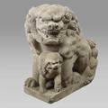 Japanese stone lion and cub one of a pair of guardians the mother lion seated on a rectangular plinth with cub beneath 32 x 16 x 28