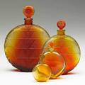 Lalique worth vers le jour set of four perfumes in frosted amber glass larger and clear glass smaller france ca 1926 m p 952 no 6 all molded worth three largest molded r lalique fran