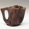 George ohr pitcher with cutout handle deep matte red glaze biloxi 1900s script signature 4 14 x 5 34