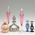 Steuben etc seven perfume bottles 20th c two steuben gold ruby shape 6237 three hawkes silver resist bottles one not pictured coalport porcelain bottle with handpainted reserve and silver