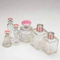 Sterling and enamel perfume bottle group six all with pink tops 20th c tallest 5 34