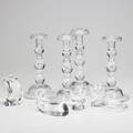 Steuben two pair of teardrop candlesticks together with whale and pig figures two cigarette holders and two ashtrays 20th c all marked tallest 10 12