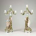 German porcelain pair of 3arm porcelain candelabra with cherub picking flowers for a young woman late 19thearly 20th c marked schierholz 20 12 x 9 12