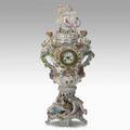 Monumental german porcelain clock cupid and floral reliefs french time and strike movement 19th c repairs and restoration 33 12 x 16 x 14 12