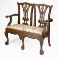 Chippendale style childs settee mahogany frame with slip seat ribbon back and ball and claw feet 20th c 25 x 29 x 13