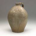 New jersey stoneware jug ovoid 1 12 gal jug with incised floral and sprig decoration dated 1823 11 12