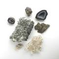 Mineral and gem specimens seven pieces quartz calcite geodes and smokey quartz largest 6 x 12 x 7