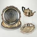 Collection of silver plate five pieces two cicular salvers by tiffany  co cheltenham  co teapot with ebony handle and finial marked sheffield england salver by holmes  edwards american sil