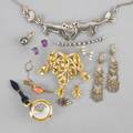 Gold and silver jewelry and a watch fourteen pieces 20th c gold elements include pearl and sapphire crescent pin tahitian pearl and diamond enhancer opal earrings coral tie bar amethyst earri