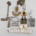 Modernist jewelry nine pieces three cast bronze necklaces by pentti sarpaneva finland silver mounted glazed ceramic bracelet and earrings denmark sterling boomerang brooch and doublepin brooch