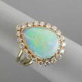 Pearshaped opal and diamond ring ca 1960 pearshaped opal cabochon approx 85 cts framed by fine brilliant cut diamonds approx 88 ct tw in 14k yg 65 dwt gw 10 gs gw size 7 14