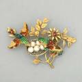 Enameled gold nesting birds brooch italy ca 1965 18k yg enameled birds on flowering branches with pearl eggs in white gold basket 72 dwt 113 gs 1 78