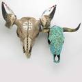 Bison skulls two turquoise encrusted the other carved larger 14 x 22 12 x 22