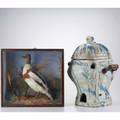 Decorative arts two pieces 19th20th c italian faience furnace with blue and white glazing together with taxidermy duck diorama taller 19