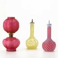 Vintage glass three pieces 19th c swirled satin glass tonic bottle vaseline glass tonic bottle and a quilted satin glass miniature lamp tallest 8