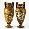 English arts  crafts pottery pair of twohandled urns decorated with dogwoods signed r guild each 17 14 x 7