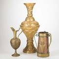 Brass and copper group arts and crafts three handled container together with brass ewer and middle eastern tall vase 19th20th c tallest 27