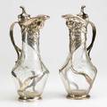Moser schellenberg pair of claret jugs bohemia ca 1900 wheel carved glass chased and repousse silver silver stamped ad schellenberg with touchmarks 12 12 x 5