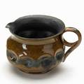George ohr dimpled pitcher with gunmetal and ochre glaze biloxi ms 1900s stamped ge ohr biloxi miss 2 12 x 4 12