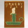 Grueby rare advertising tile with candle brown ground boston ca 1910 6 x 4 12