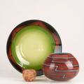 Native american style three pieces umber art glass bowl apache 44 decorated with geometric pattern by leonard dinardo 1981 ceramic charger with russet and green glaze by marti mocahbee redwar