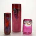 Contemporary art glass group of three pink cylindrical studio glass vessels with abstract decoration all signed tallest 14