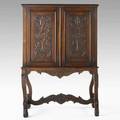 Jacobean style cabinet walnut with carved door and side panels early 20th c 60 x 41 x 22