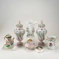 Chinese export group seven items 18th19th c pair of urns small teapot armorial threehandled vessel blanc de chine vase reticulated covered bowl and small covered box tallest 13