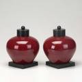 Asian porcelain pair of oxblood glazed porcelain ginger jars with brass lids and bases 8 x 7